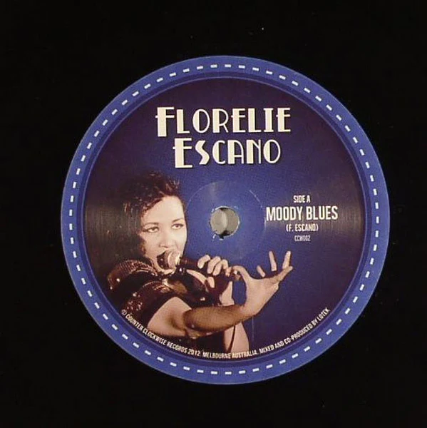 Florelie Escano – Moody Blues / The Liberating Kind (VG+/Generic) – 7", AU 2012